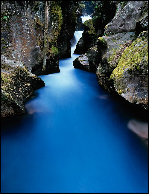 Avalanche Creek, blue colored water caused by glacial silt, Glacier National Park, Montana, July